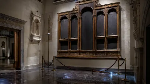 Empty museum display in Messina after panels from a Renaissance altarpiece were stolen.