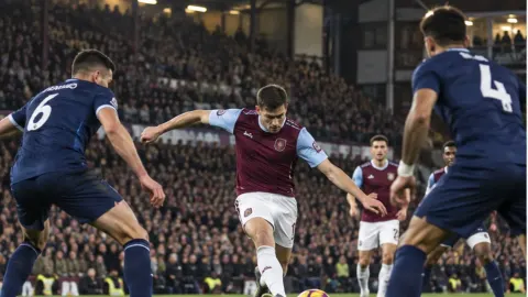 Editorial illustration of anonymous claret-and-blue and navy players contesting a fierce London derby