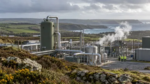 Editorial illustration of a geothermal lithium extraction facility in the Cornish landscape
