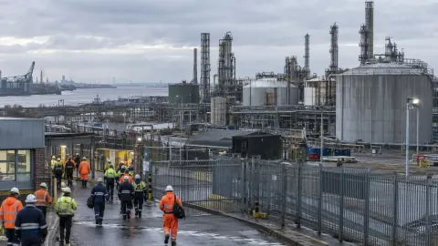 Editorial illustration of a quiet chemical manufacturing complex in Hull under overcast skies