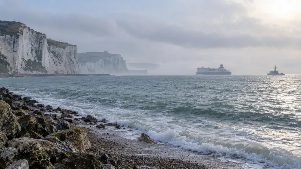 Editorial illustration of the English Channel coast with distant ferry and patrol vessel